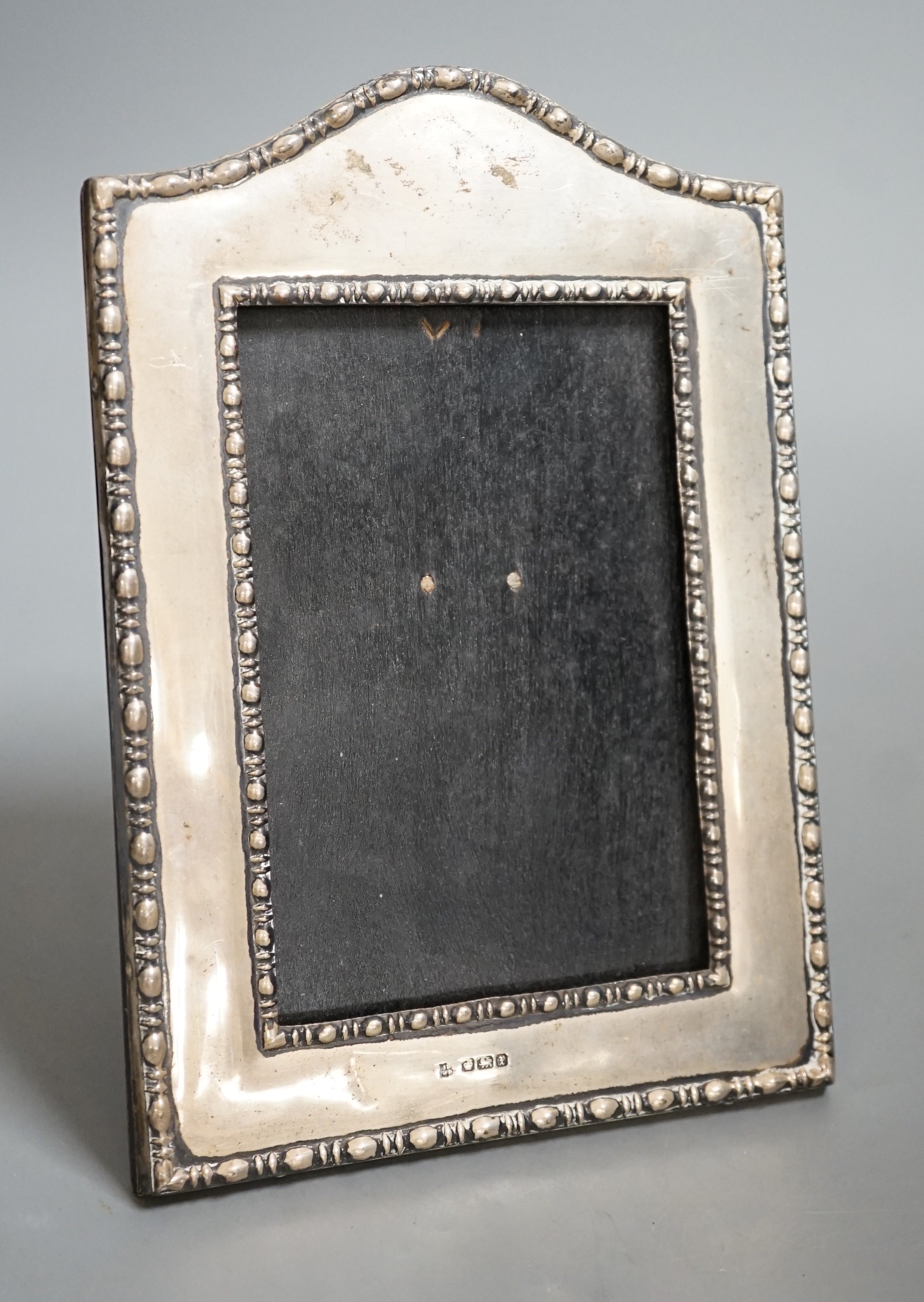 A George V silver mounted photograph frame, James Deakin & Sons, Sheffield, 1915, 19.6cm.